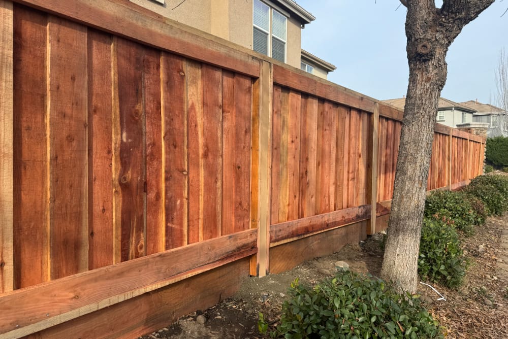 Installation of a new privacy fence that is at least 100 feet long